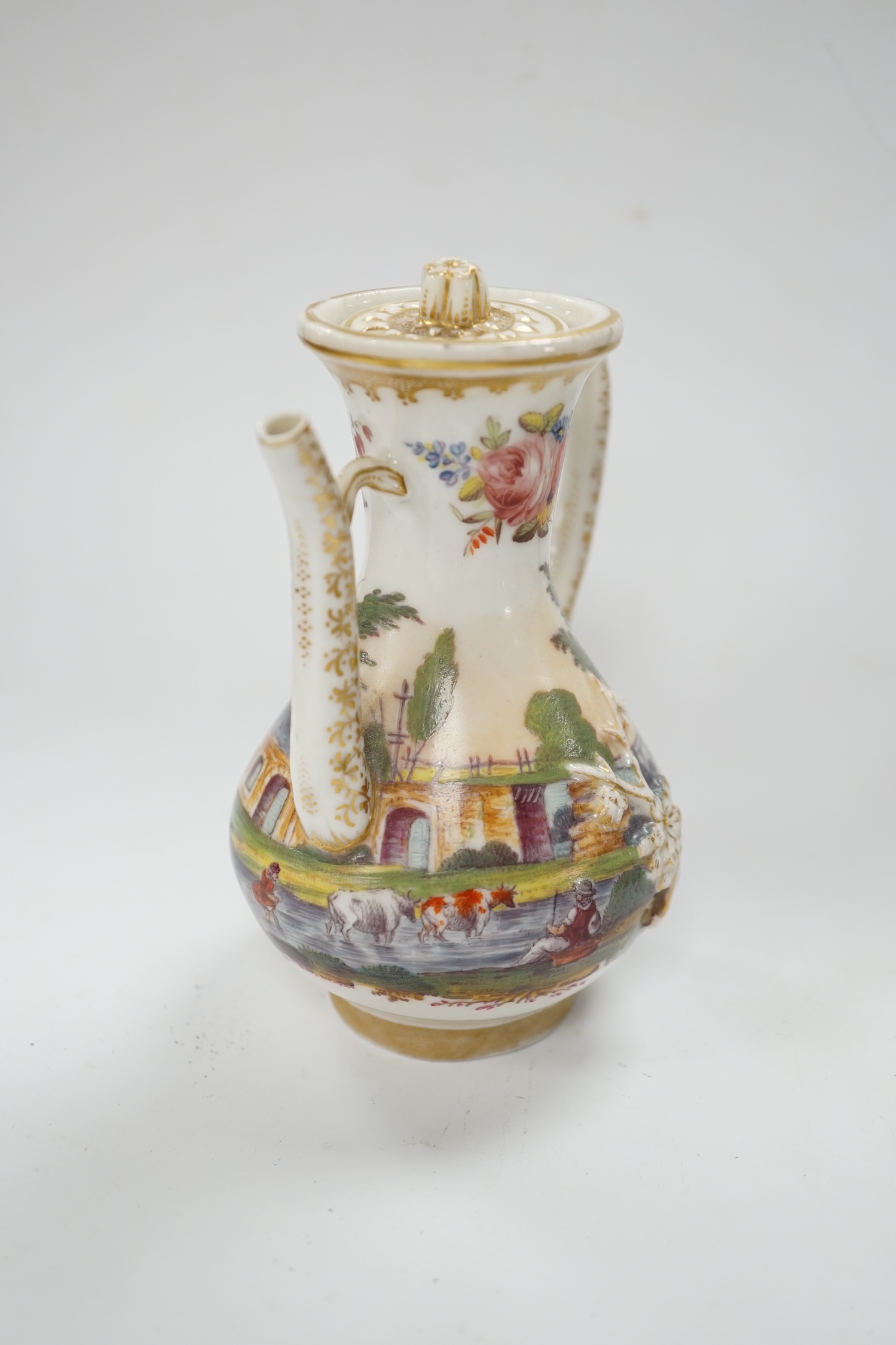 A 19th century Paris porcelain ewer and cover, hand painted with a riverscape and cattle, 13cm high. Condition - fair
